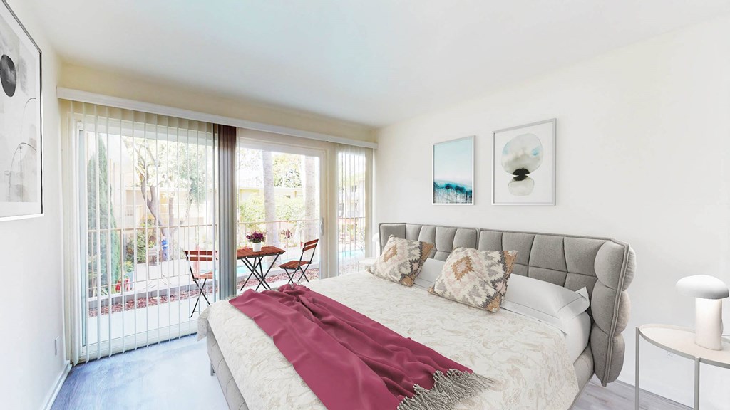 Two Bedroom Plan A - bedroom and balcony at West Park Village Apartment Homes