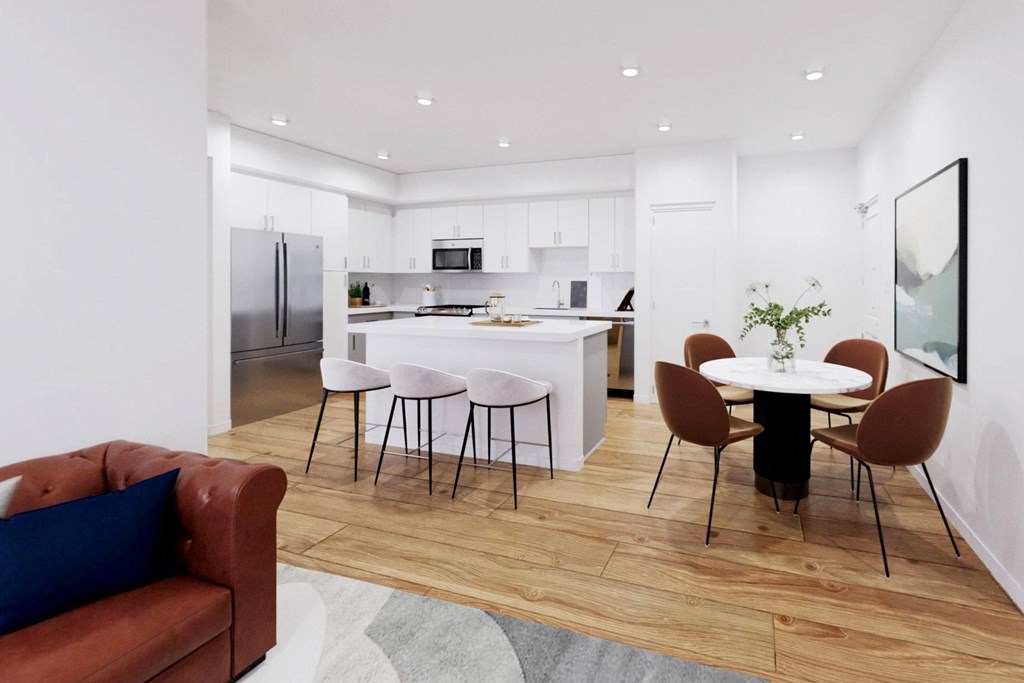 A modern kitchen with a dining table set for four at The Villas at Anacapa Canyon, Camarillo, 93012