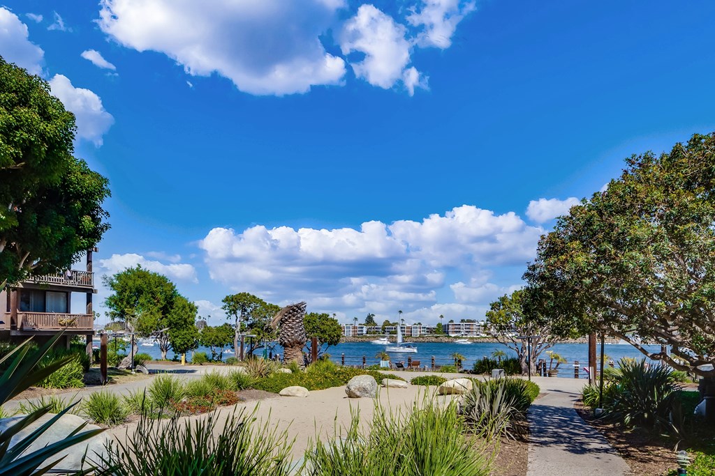A clear day at the beach with a wooden structure on the left at Mariners Village, Marina del Rey, 90292