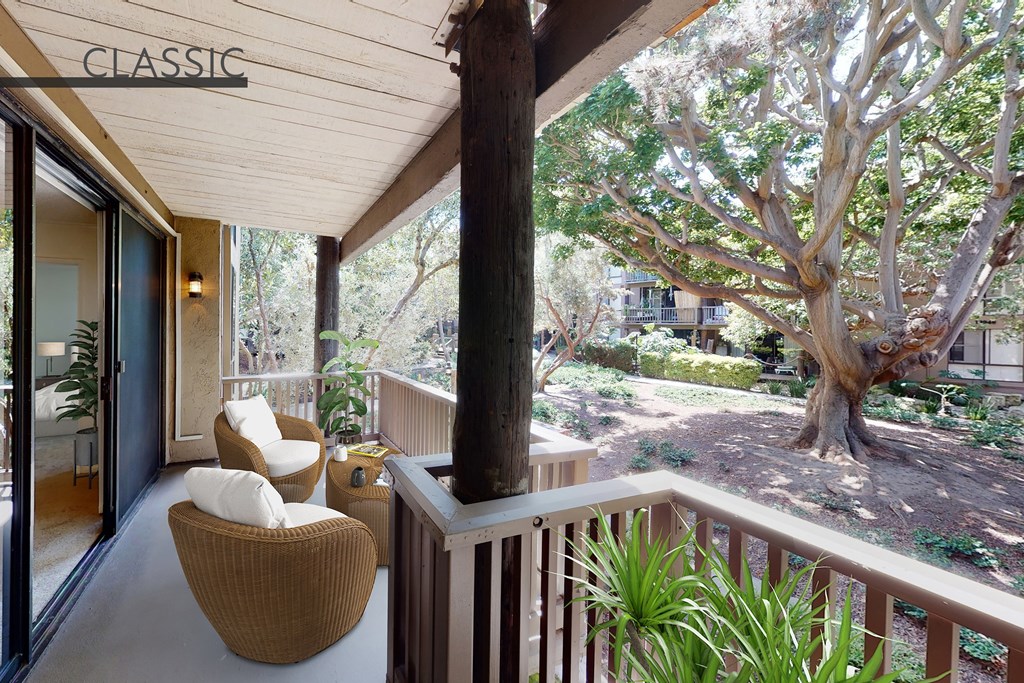 A balcony with a chair and a table with a sign that says at Mariners Village, Marina del Rey, 90292