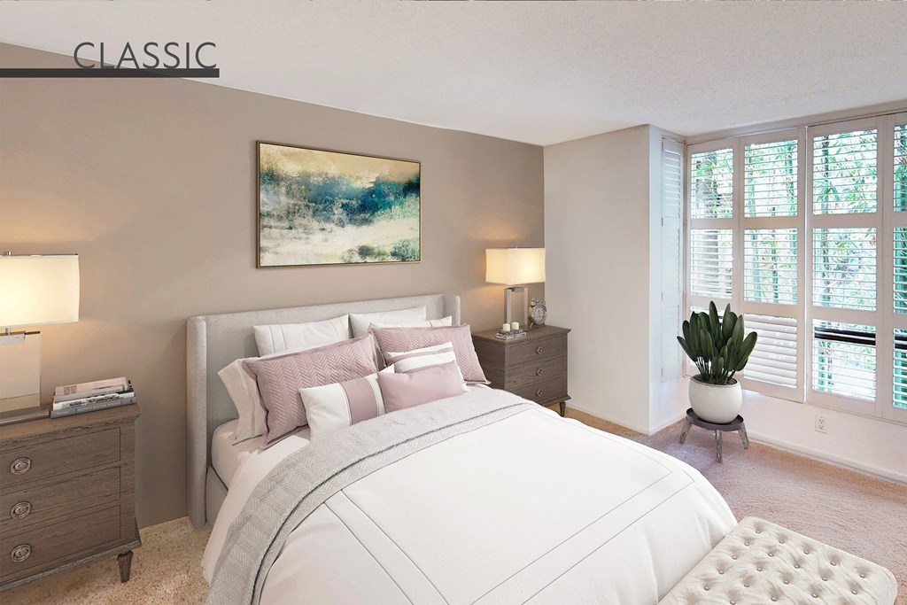 A bedroom with a large bed, a nightstand, and a painting on the wall at Mariners Village, Marina del Rey, 90292