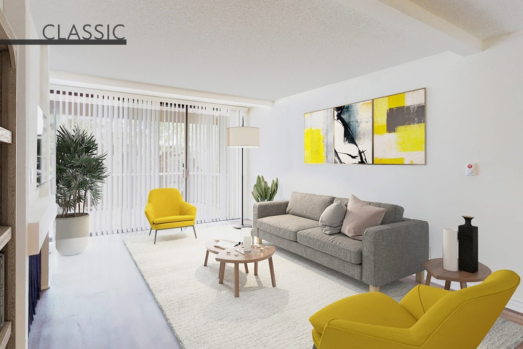 A living room with a grey couch, yellow chairs, and a painting on the wall at Mariners Village, Marina del Rey, 90292