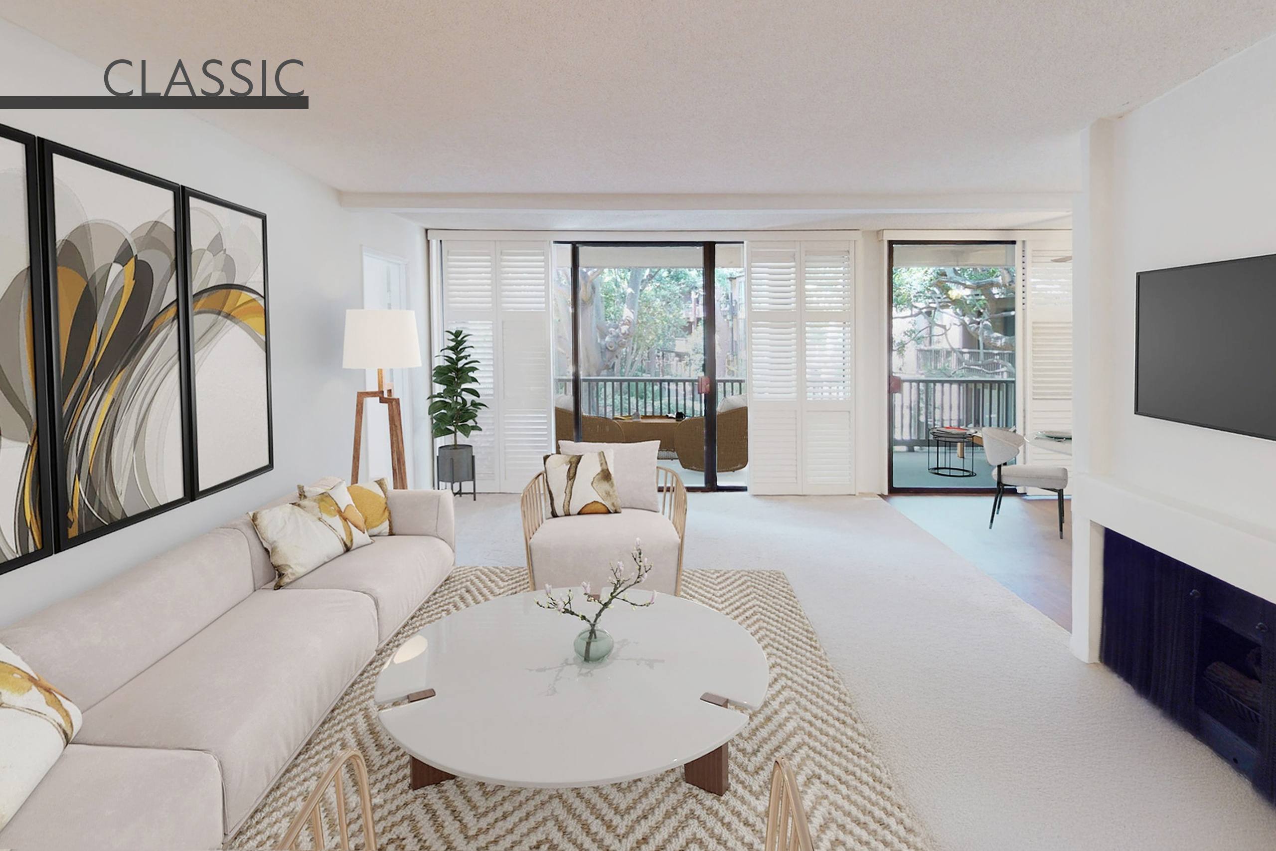 A living room with a white couch and a coffee table.