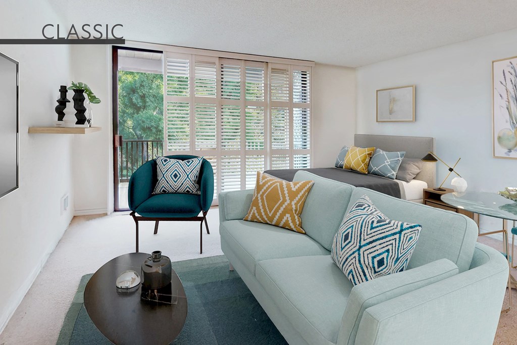 A living room with a blue couch and a green chair at Mariners Village, Marina del Rey, 90292