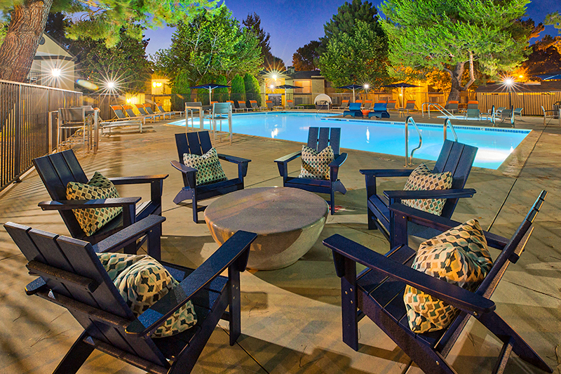 Pool area at dusk at Mountain Vista Apartment Homes