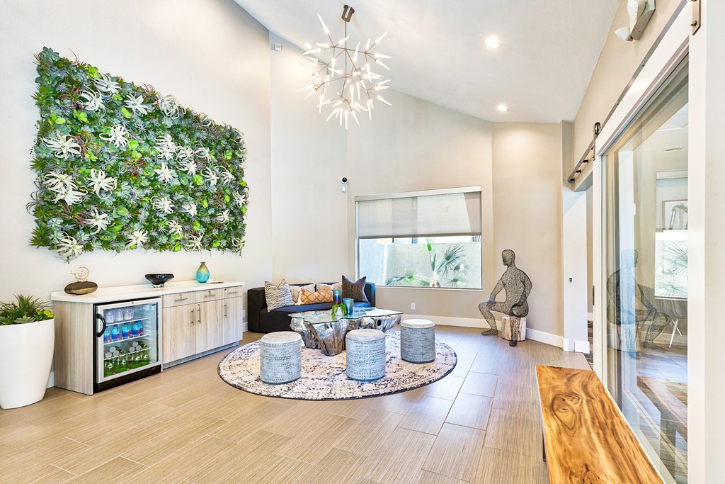 A living room with a green wall and a wooden bench at Mountain Vista, Victorville, CA