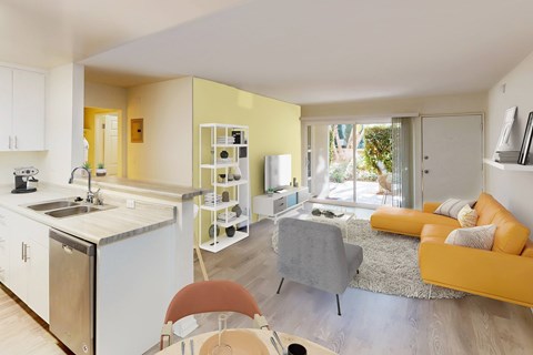 A modern kitchen with a dining area and a living room.