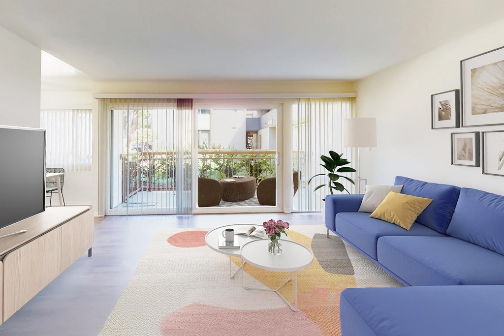 A living room with a blue couch and a television at West Park Village, Los Angeles, CA