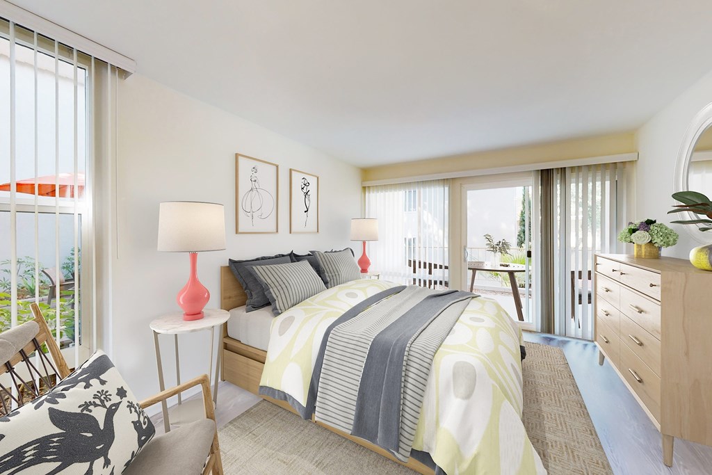 A bedroom with a large bed, a chair, and a table with a lamp on it at West Park Village, Los Angeles, CA