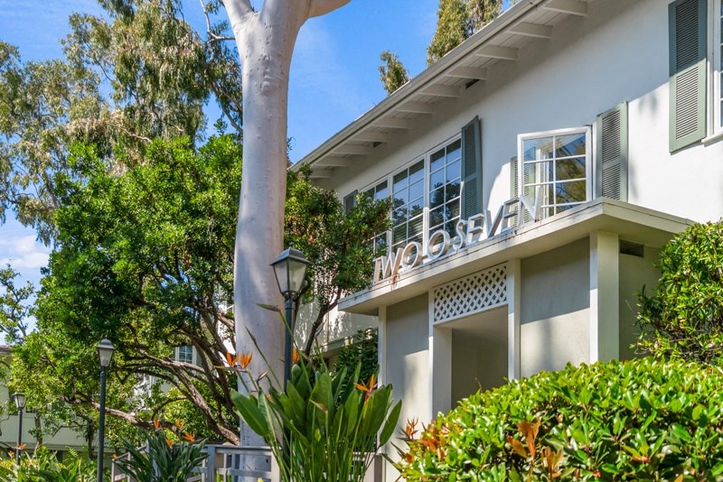 a condo building with a sign on the side of it