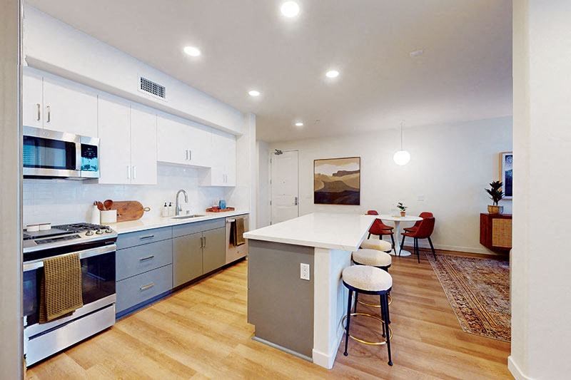 a kitchen with a white counter top and a stove at The Villas at Anacapa Canyon, California, 93012