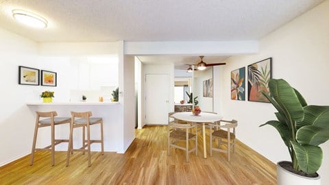 Dining area, kitchen, and living room at Village Pointe Apartment Homes