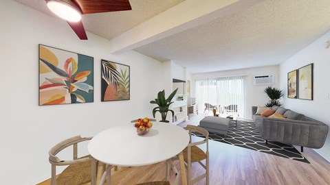 Dining area and living room at Village Pointe Apartment Homes