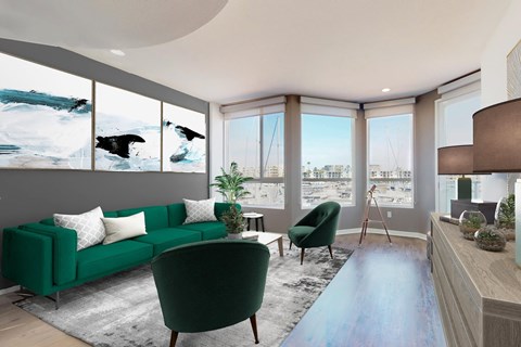 A living room with a green couch and a blue rug.