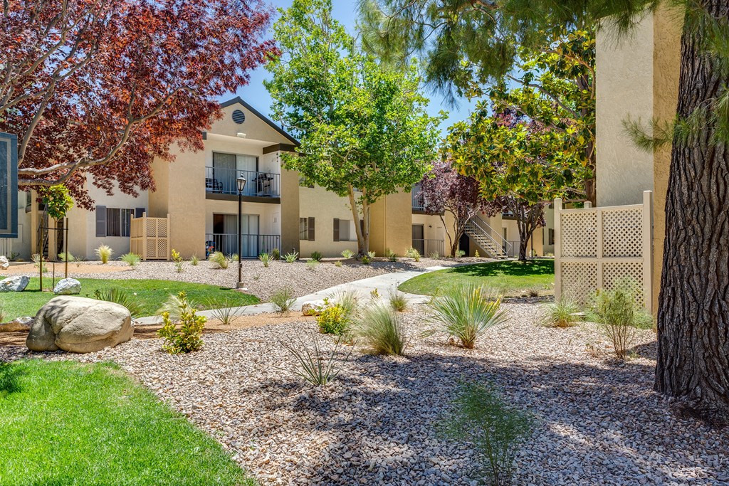 A modern house with a well-maintained garden in front at Mountain Vista, Victorville, CA