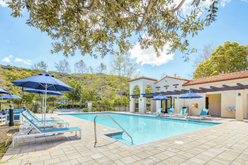 a swimming pool in front of a hotel with a pool at The Villas at Anacapa Canyon, Camarillo, California