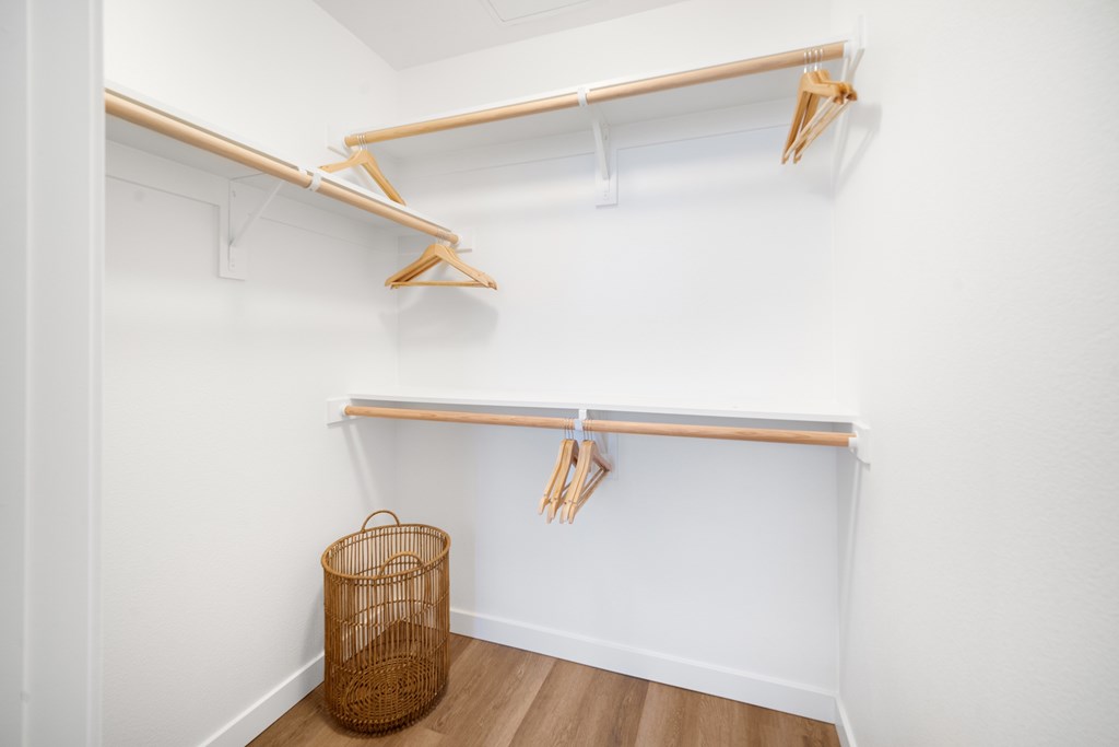 A white wall with a clothes rack and a basket at The Villas at Anacapa Canyon, Camarillo, 93012