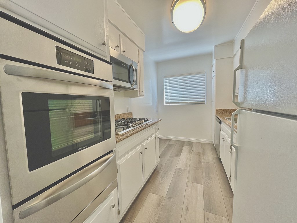 Kitchen with Stainless Steel Appliances and White Cabinets