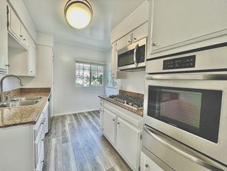 Kitchen with Stainless Steel Appliances and White Cabinets