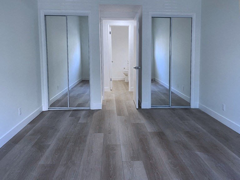 Bedroom with Two Closets and Hard Floor
