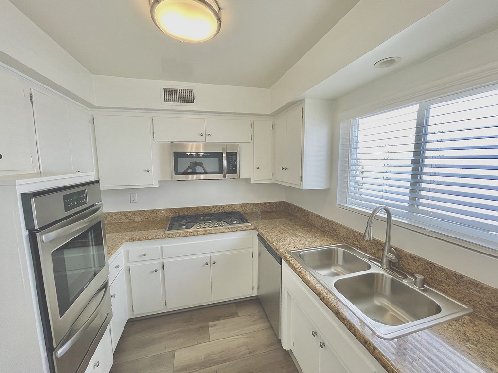 Kitchen with Stainless Steel Appliances and White Cabinets