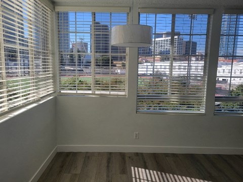 the view of the city from the window of a living room