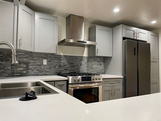 Kitchen with Stainless Steel Appliances and White Cabinets