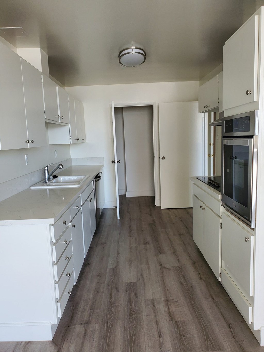 Kitchen with White Appliances and White Cabinets