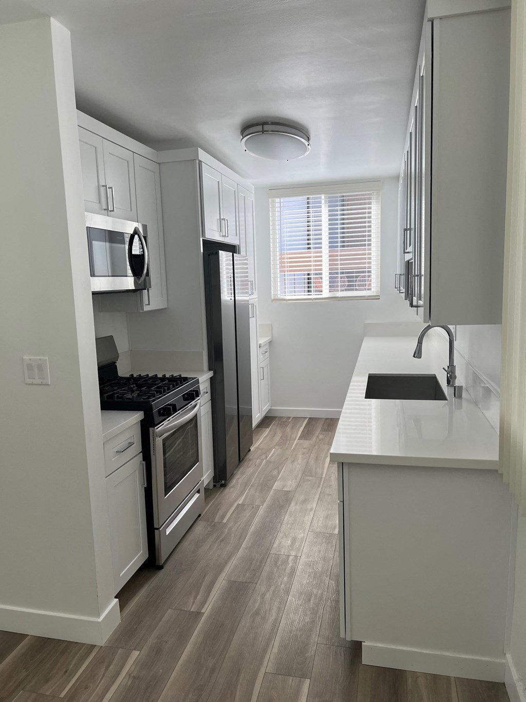 Kitchen with Stainless Steel Appliances and White Cabinets