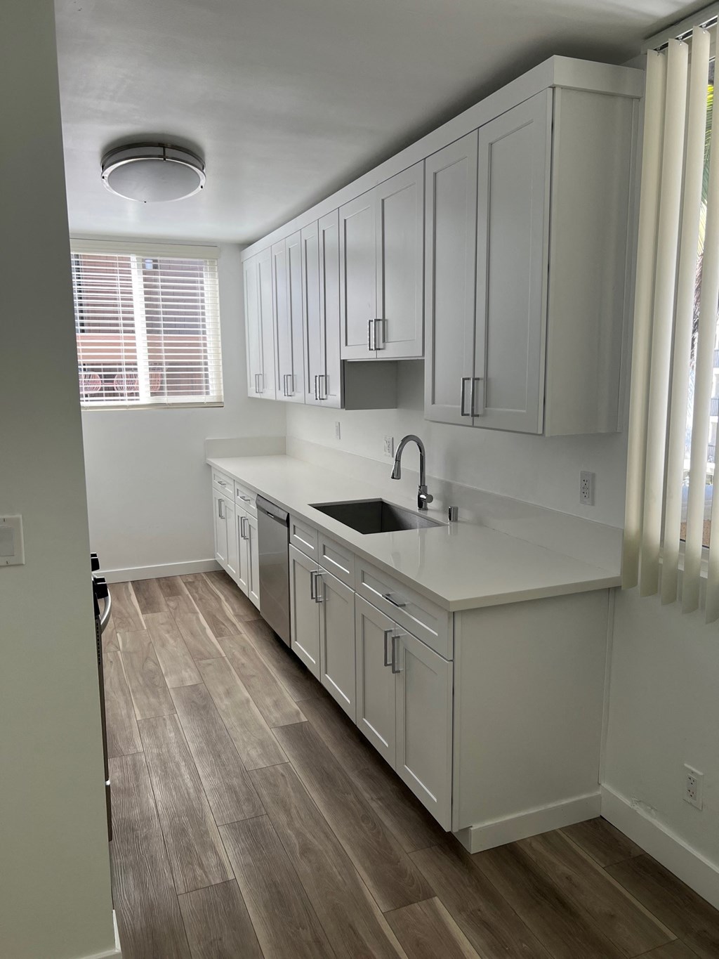 Kitchen with Stainless Steel Appliances and White Cabinets