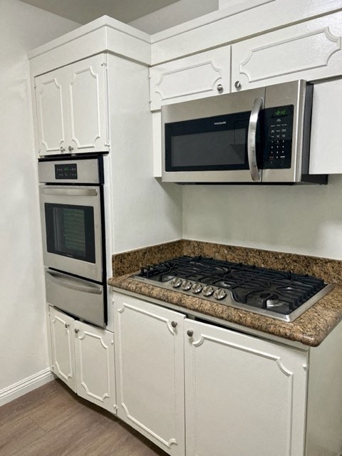Kitchen with White Cabinets and Hard Floor