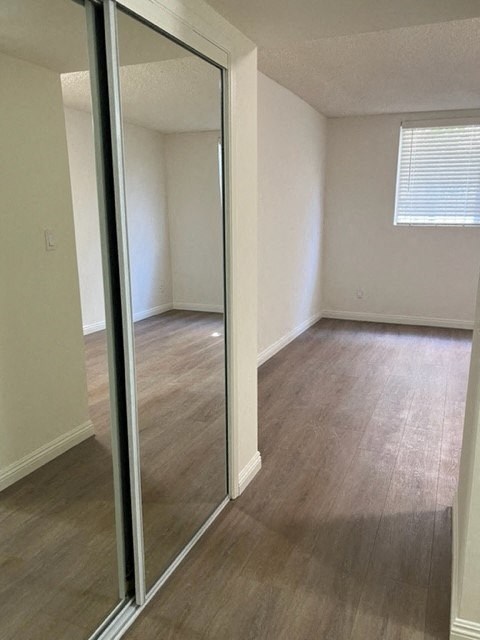 an empty room with a mirror in it