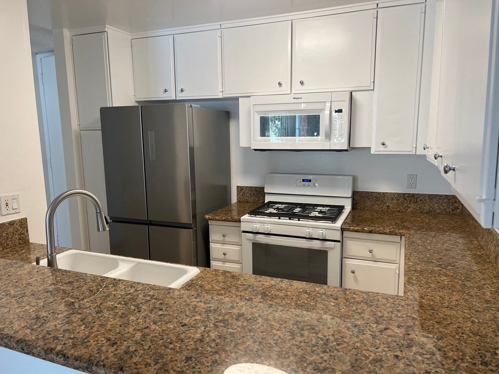 Kitchen with White Appliances and White Cabinets