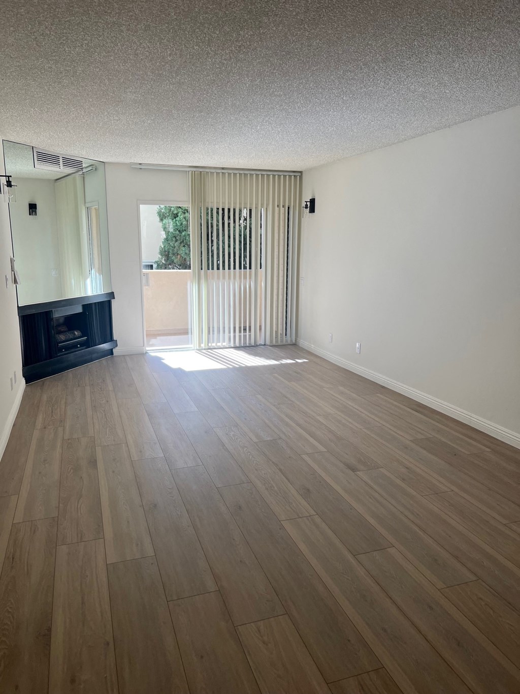 Bedroom with Hardwood Floors, Fireplace and Patio Doors