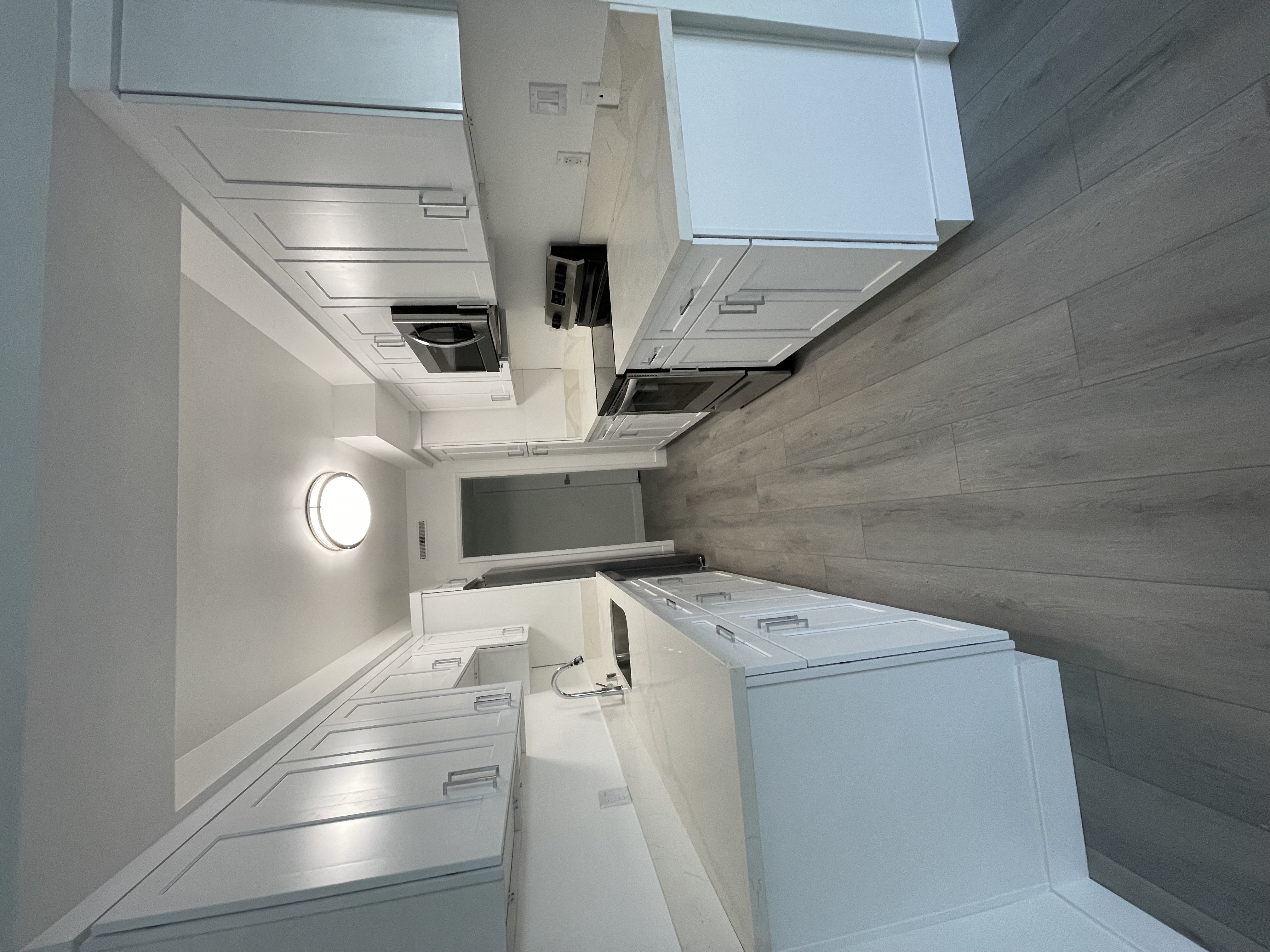 Kitchen with White Cabinets and Stainless Steel Appliances