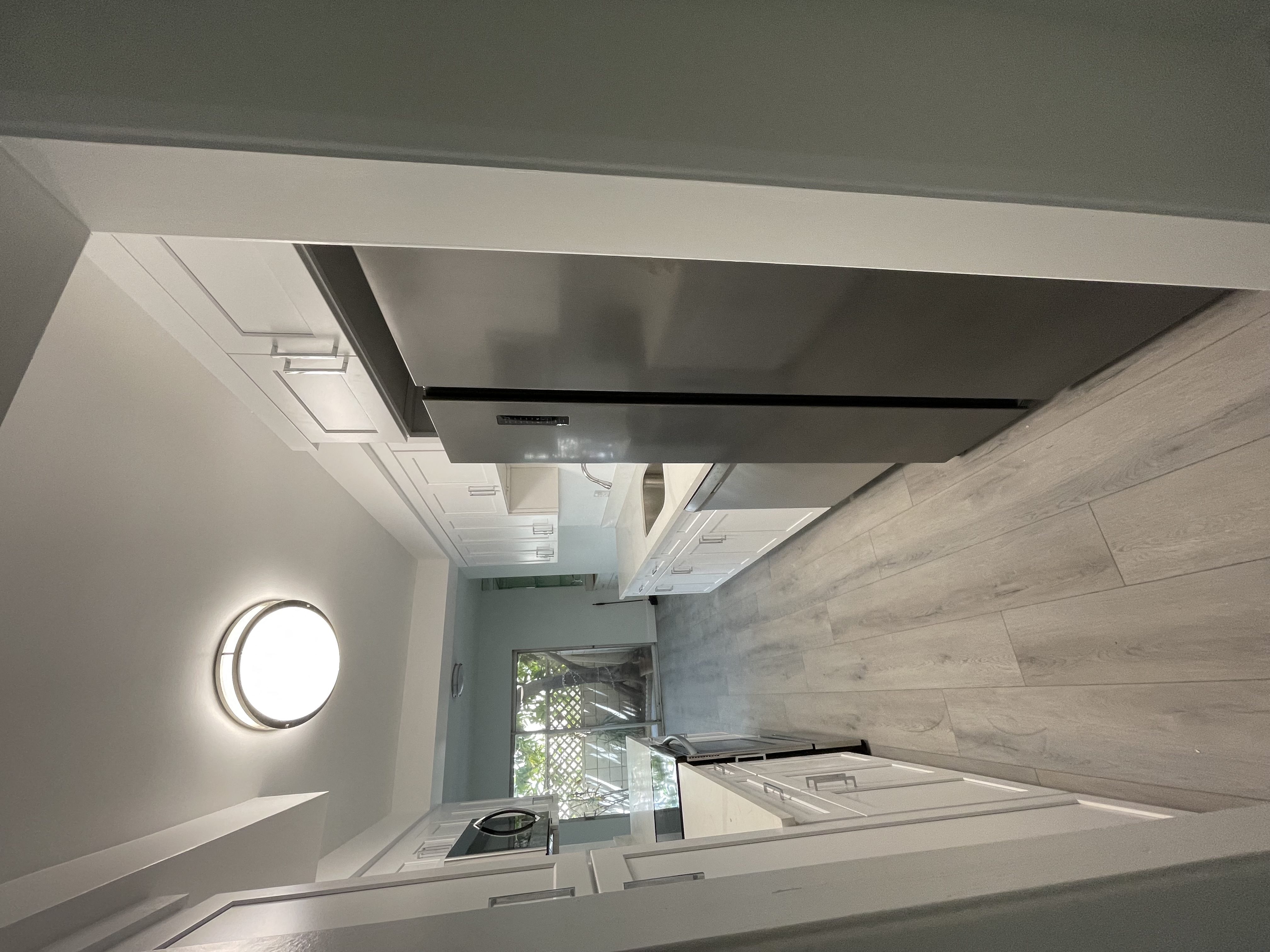 Kitchen with White Cabinets and Stainless Steel Appliances