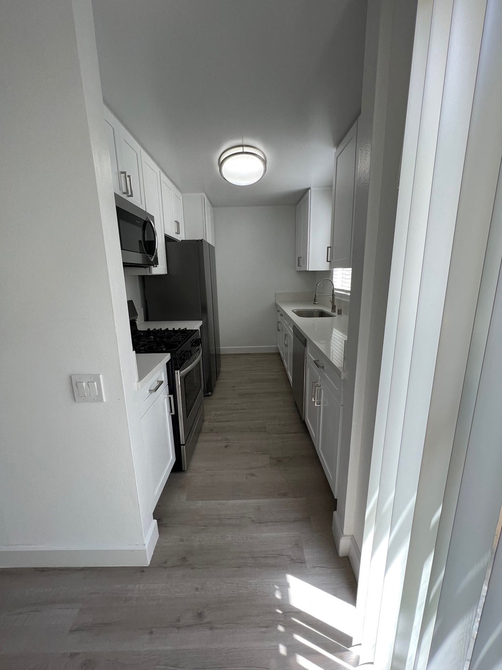 Kitchen with Stainless Steel Appliances and White Cabinets