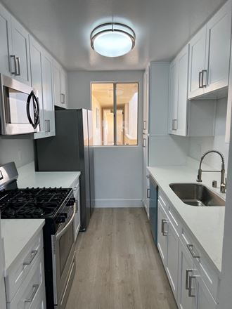 Kitchen with Stainless Steel Appliances and White Cabinets