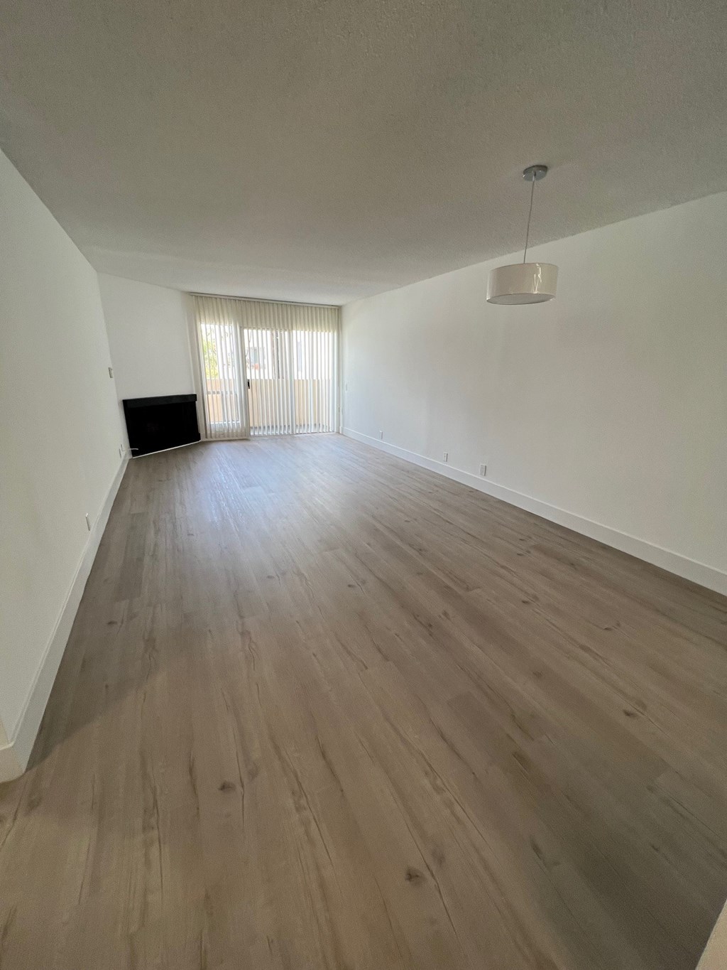 Bedroom with Hardwood Floors, Fireplace and Patio Doors