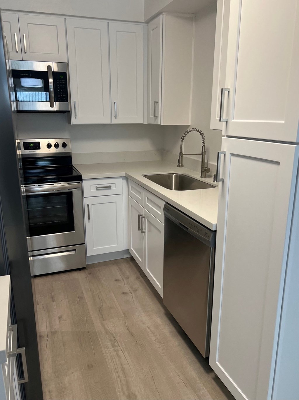 Kitchen with Stainless Steel Appliances and White Cabinets\\