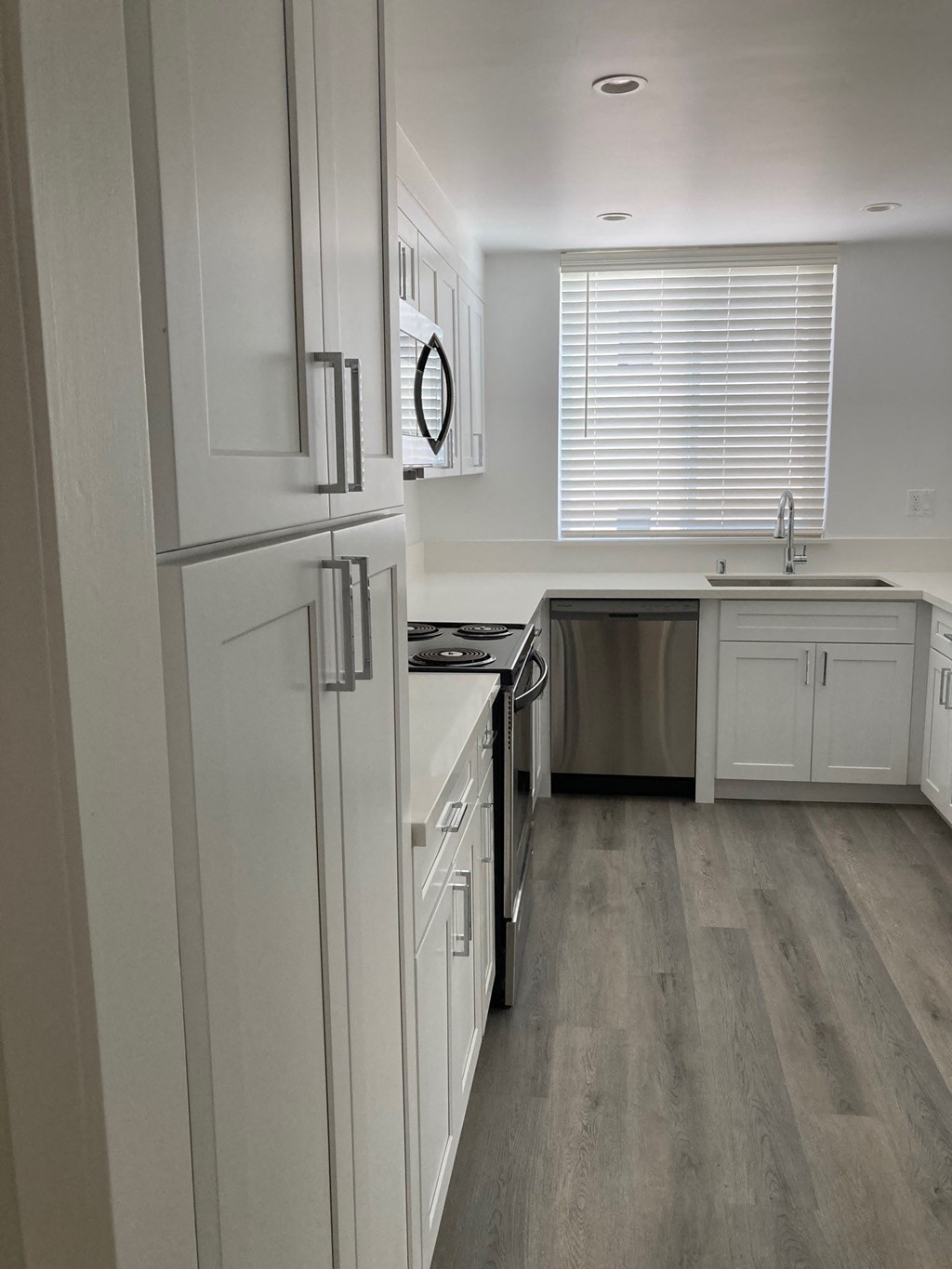 Kitchen with Stainless Steel Appliances and White Cabinets