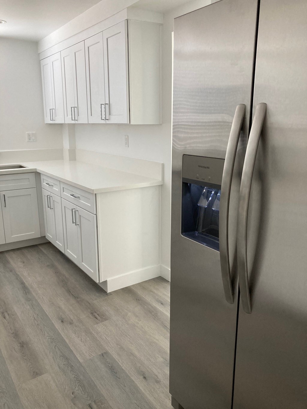 Kitchen with Stainless Steel Appliances and White Cabinets