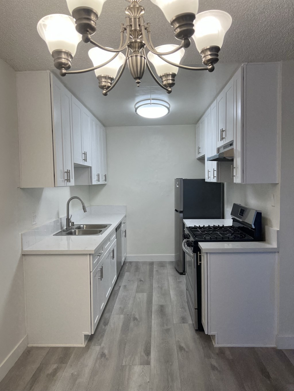 Kitchen with Stainless Steel Appliances and White Cabinets