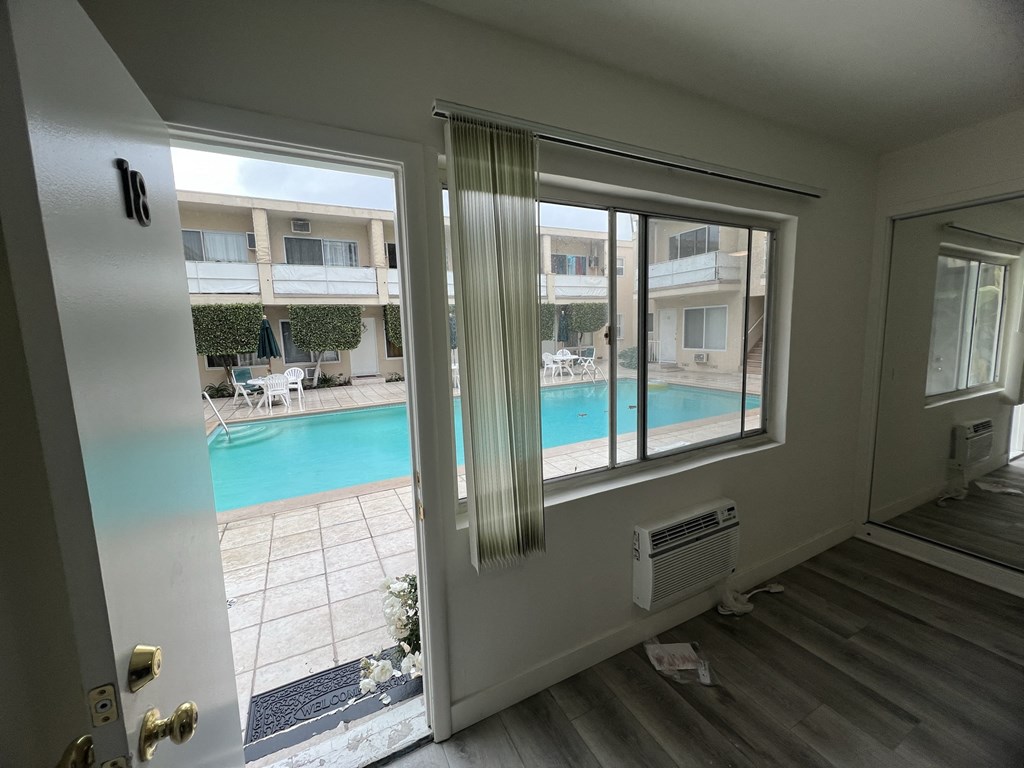 Apartment Front Door with Access to Pool