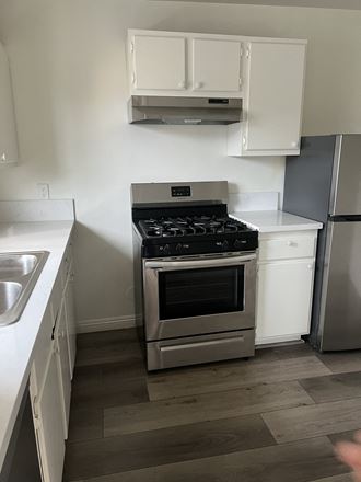 Kitchen with Stainless Steel Appliances and White Cabinets