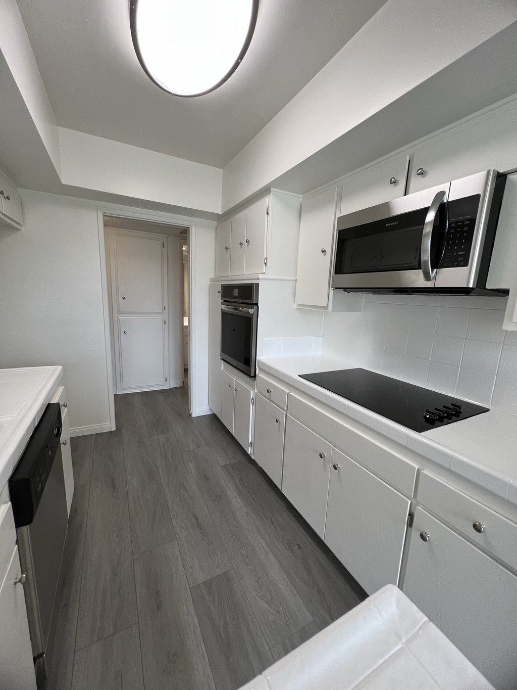 Kitchen with Stainless Steel Appliances and White Cabinets