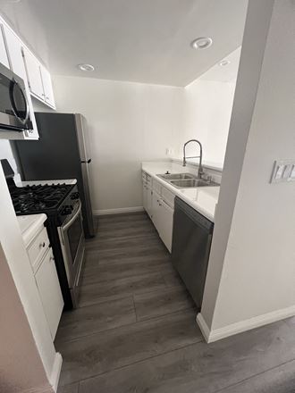 Kitchen with Stainless Steel Appliances and White Cabinets