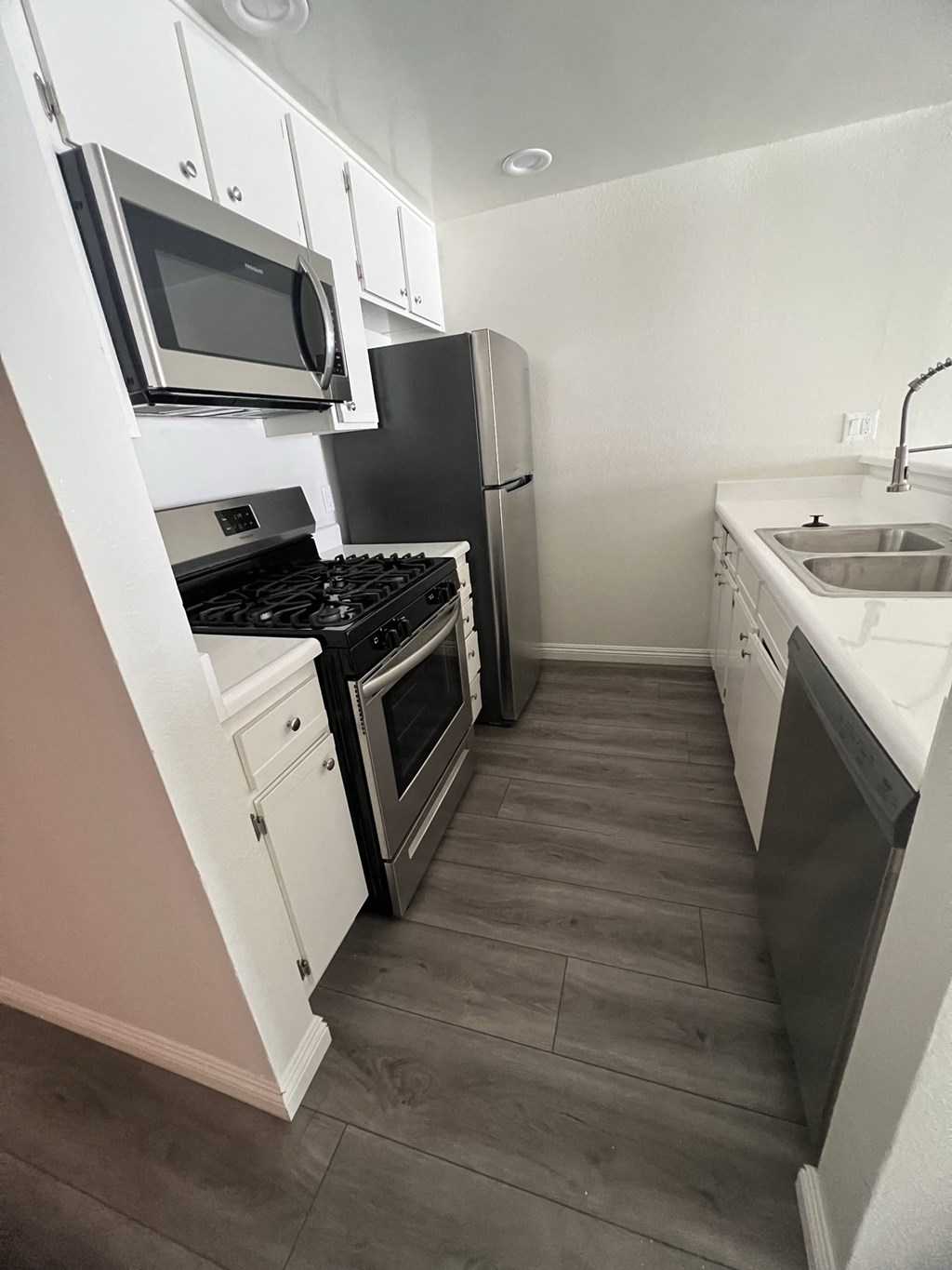 Kitchen with Stainless Steel Appliances and White Cabinets