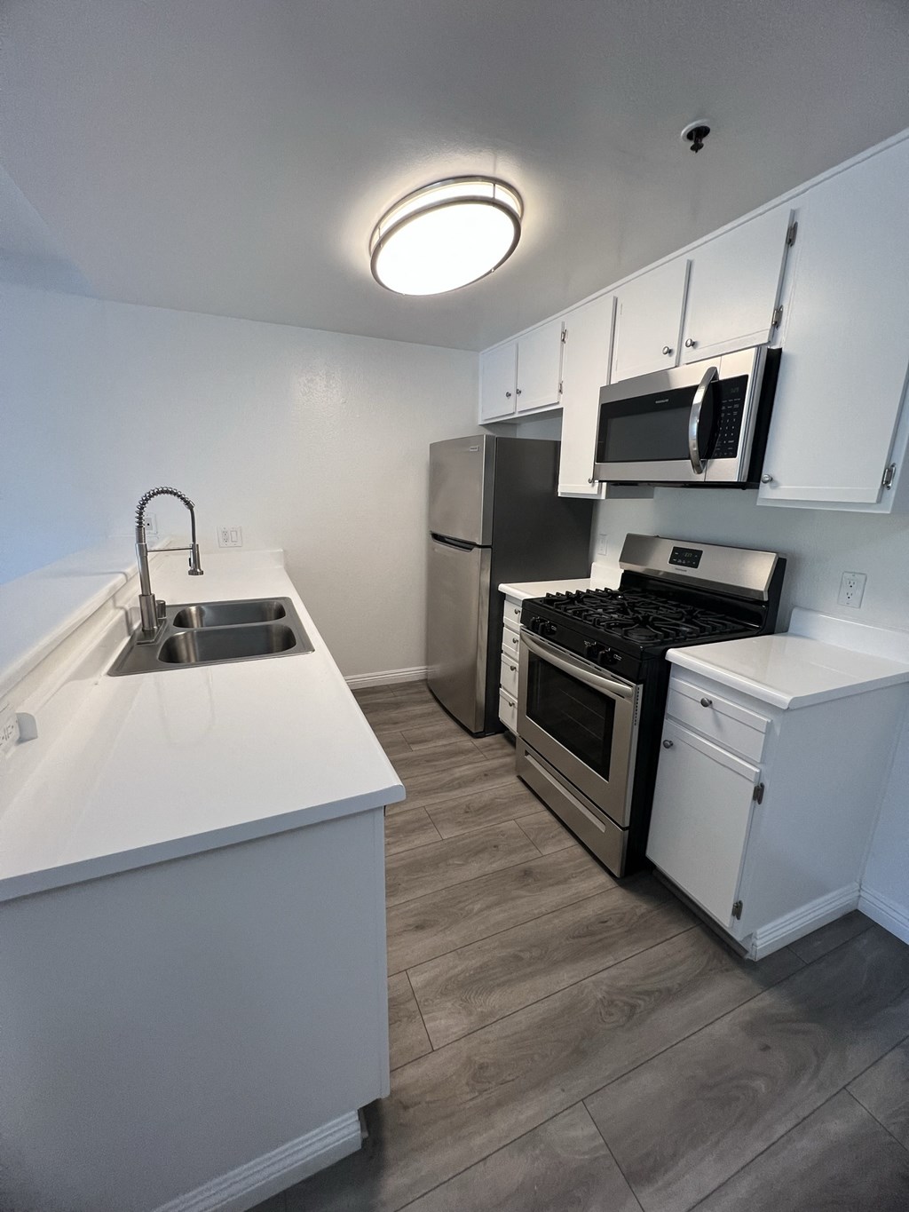 Kitchen with Stainless Steel Appliances and White Cabinets