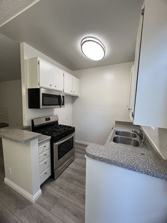 Kitchen with Stainless Steel Appliances and White Cabinets
